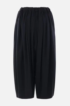 Women COMME DES GARÇONS balloon trousers in lightweight wool