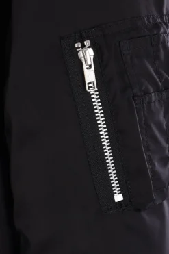 BLACK COMME des GARÇONS reversible asymmetrical bomber jacket.